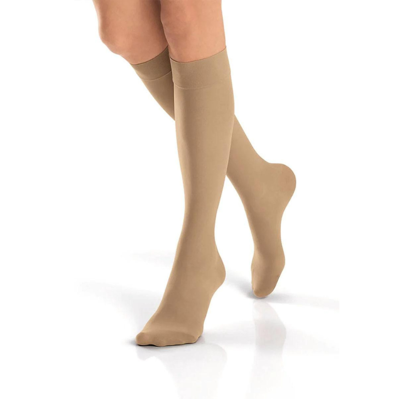 woman's legs showcasing beige compression knee socks